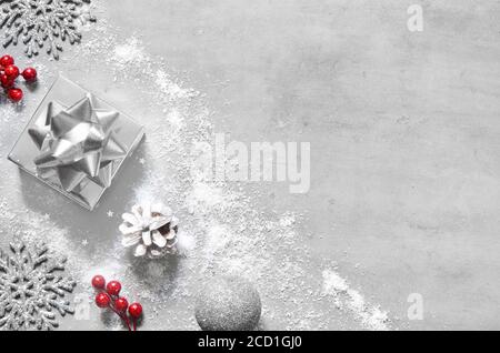 Christmas silver handmade gift boxes on white grey background top view. Merry Christmas greeting card, frame. Winter xmas holiday theme. Happy New Yea Stock Photo