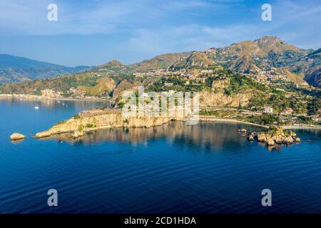 Aerial panoramic view of the town of Taormina, Isola Bella island nature reserve, and Mount Etna on the east coast of Sicily, Italy Stock Photo