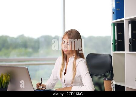 Modern business woman in the office blonde Stock Photo