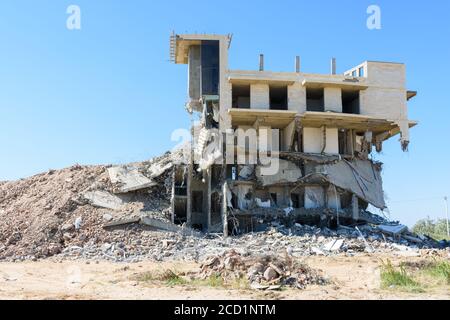 Half-destroyed building due to illegal development of the coastal strip Stock Photo