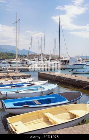 Yachts and fishing boats in harbor, summer Mediterranean landscape. Montenegro, Bay of Kotor near city of Tivat Stock Photo