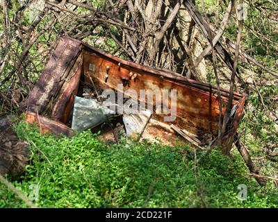 The Woodlands TX USA - 02-07-2020  -  Old Rusted Refrigerator a Flooded 2 Stock Photo