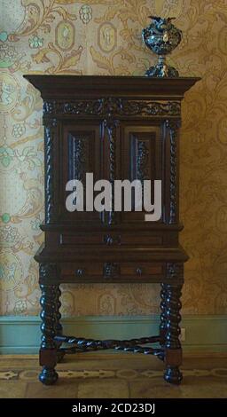 A really dark piece of wooden furniture Stock Photo