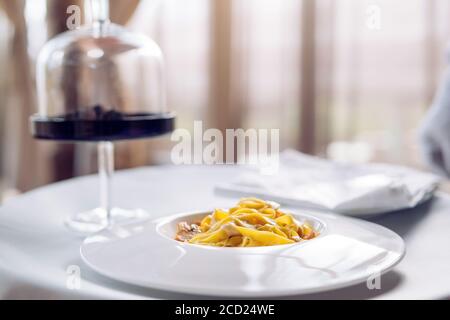 Pasta with truffles, typical autumn dish.Restaurant menu dish. Stock Photo