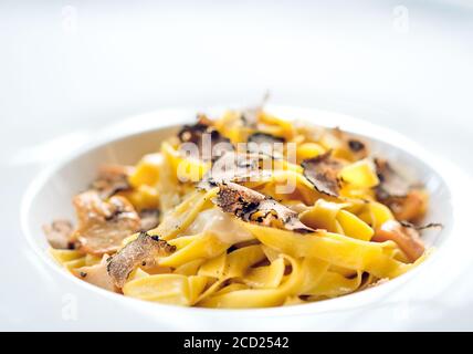 Pasta with truffles, typical autumn dish.Restaurant menu dish. Stock Photo