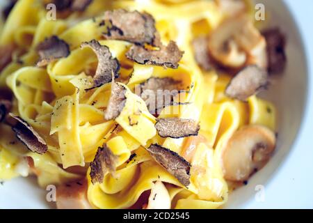 Pasta with truffles, typical autumn dish.Restaurant menu dish. Stock Photo