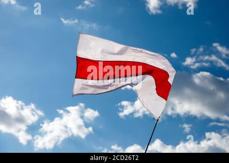 White-red-white flag on blue sky background. Historical Belarus authentic flag Stock Photo