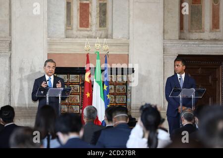 Rome, Italy. 25th Aug, 2020. Visiting Chinese State Councilor and Foreign Minister Wang Yi (L) speaks at a press briefing with Italian Foreign Minister Luigi Di Maio in Rome, Italy, Aug. 25, 2020. Wang Yi said here Tuesday that starting 'a new Cold War' is to reverse the course of history and kidnap the whole world. Credit: Cheng Tingting/Xinhua/Alamy Live News Stock Photo