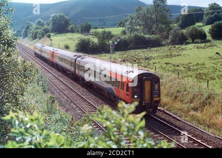 Edale, UK - 1 August 2020: A passenger train operation by EMR (East Midlands Railway) through Edale to Sheffield direction. Stock Photo