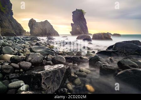 Different shapes and sizes of stones in Dipaculao Beach, Baler, Philippines Stock Photo