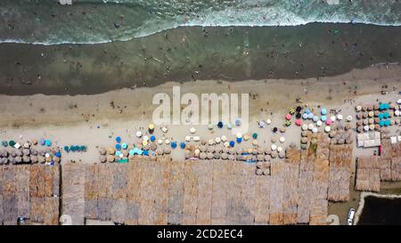 Vacationers at the seaside on the beach Stock Photo