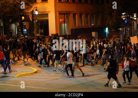 Rioters in the streets of wisconsin state capitol madison light fires in garbage bins to protest the death of jacob black of kenosha. Stock Photo