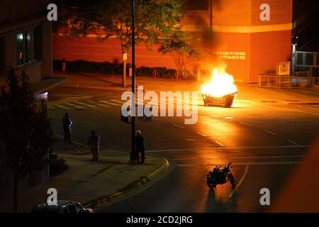 Rioters in the streets of wisconsin state capitol madison light fires in garbage bins to protest the death of jacob black of kenosha. Stock Photo