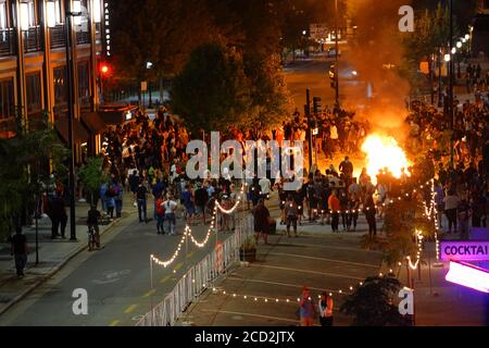 Rioters in the streets of wisconsin state capitol madison light fires in garbage bins to protest the death of jacob black of kenosha. Stock Photo