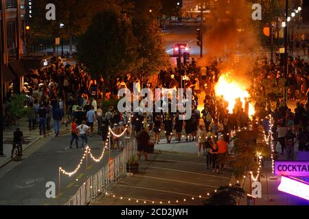 Rioters in the streets of wisconsin state capitol madison light fires in garbage bins to protest the death of jacob black of kenosha. Stock Photo