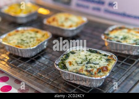 close up of Baked lasagna in a metal dish in street market Stock Photo