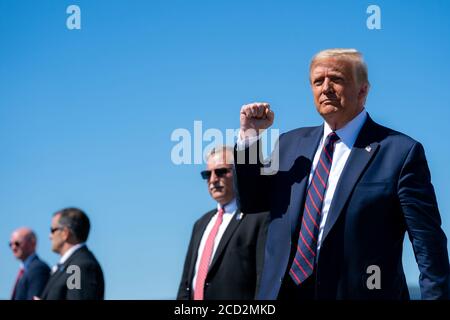 AVOCA, PA, USA - 20 August 2020 - US President Donald J. Trump gestures with a fist-pump as he disembarks Air Force One at Wilkes-Barre Scranton Inter Stock Photo