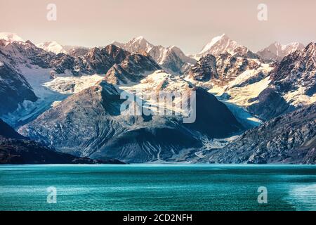 Glacier Bay National Park, Alaska, USA. Alaska cruise travel view of snow capped mountains at sunset. Amazing glacial landscape view from cruiseship Stock Photo
