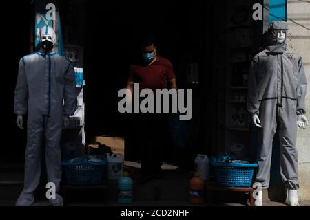 Kathmandu, Nepal. 25th Aug, 2020. Mannequins wearing personal protective equipment (PPE) displayed outside a drug store during the coronavirus pandemic.Nepal is in the second lockdown since 20th Aug as a preventative measure against the rapid spread of Covid-19. After the first national wide lockdown lift, it has seen a rapid increase in the coronavirus cases. Nepal reports 164 Covid-19 deaths as infection tally hits 33533. Credit: SOPA Images Limited/Alamy Live News Stock Photo