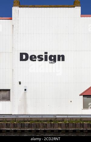 Design sign on white rolling plate wall Stock Photo