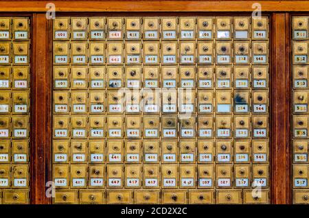Rows of brass post office boxes are located in the lobby of the Morgan City Downtown Post Office, Aug. 25, 2020, in Morgan City, Louisiana. Stock Photo