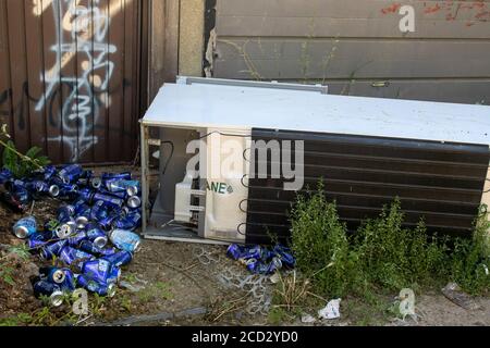 Rubbish unlawfully dumped in an urban alleyway displaying lack of concern for the environment and social irresponsibility. London, England, Europe Stock Photo