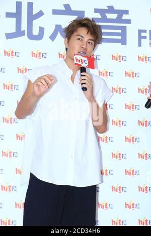 Taiwanese singer-songwriter, actor and director Kenji Wu shows up in white T-shirt to promote his new album, Taipei city, Taiwan province, 23 July 202 Stock Photo