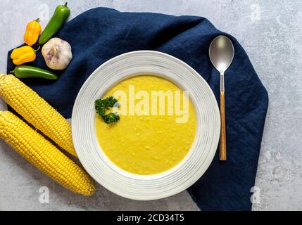 Traditional autumn spicy corn soup. Vegetarian cuisine.  Stock Photo