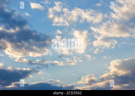 cloudy sky in yellow light. natural background at sunrise. inspiring scene Stock Photo