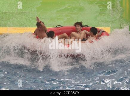 Citizens enjoy water and various aquatic activities to relieve from scorching summer heat as the Nantong Water Park opens to the tourists, Nantong cit Stock Photo