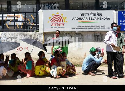 Guwahati, Assam, India. 25th Aug, 2020. People flout social distancing norms as they stand in a queue to register for Aadhar cards, amid the ongoing COVID-19 coronavirus pandemic, in Guwahati. Credit: David Talukdar/ZUMA Wire/Alamy Live News Stock Photo