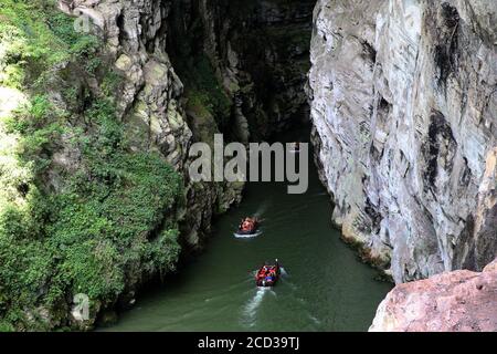 Chongqing, Chongqing, China. 26th Aug, 2020.The Puhua Subsurface river in Zhuoshui Scenic Area, Qianjiang District, Chongqing is about 2 kilometers long and 5 meters at its narrowest. It is composed of the subsurface river, karst caves, canyons and 3 natural Bridges over water. The temperature in the subsurface river keeps a constant temperature of 22Ã¢''Æ' all year round, making it a good place for people to escape from heat and get cool. Credit: ZUMA Press, Inc./Alamy Live News Stock Photo