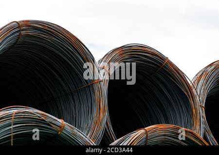 Steel wire coil isolated on white background. Metal steel reinforced for concrete construction. Iron wire for construction industry. Spool or roll Stock Photo