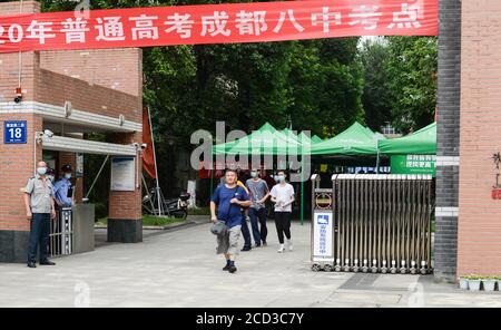 53-year-old Chinese man Liang Shi steps out of the testing center, where he just finished his 24nd Gaokao, also known as the 2020 National College Ent Stock Photo