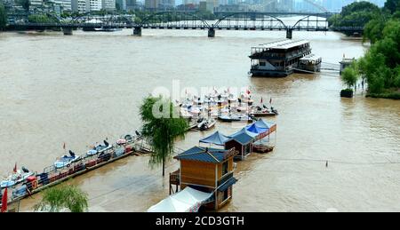 Water rises near Zhongshan Bridge in Lanzhou city, northwest China's Gansu province, 21 July 2020.   Lanzhou section of Yellow River issued fourth lev Stock Photo