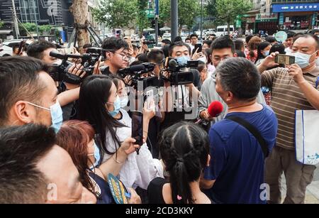 53-year-old Chinese man Liang Shi steps out of the testing center, where he just finished his 24nd Gaokao, also known as the 2020 National College Ent Stock Photo