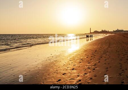 sunset at the beach, lighthouse maspalomas gran canaria Stock Photo