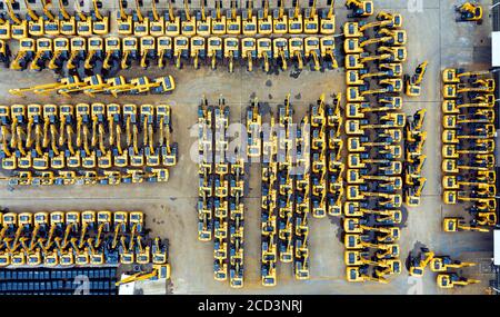 An aerial view of arrays of excavators at a factory of Chinese multinational heavy equipment manufacturing company Sany Heavy Industry Co., Ltd. in Li Stock Photo