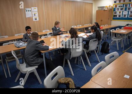 Pupils from years 7 and 11 return to Manor High School in Oadby, Leicestershire, currently the school has adopted a voluntary policy with regards to students wearing face coverings. Stock Photo