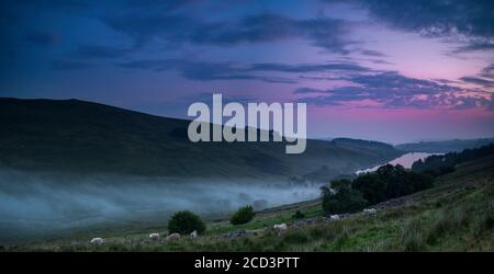 The colors of the sky before the storm. View of Cray Reservoir in Brecon Beacons National Park in Wales. Stock Photo