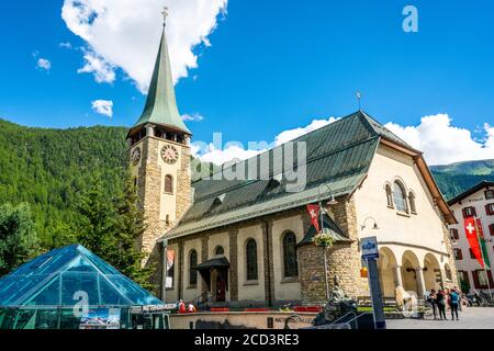 Zermatt Switzerland , 2 July 2020 : Side view of the Parish Church of St. Mauritius building in Zermatt Switzerland Stock Photo