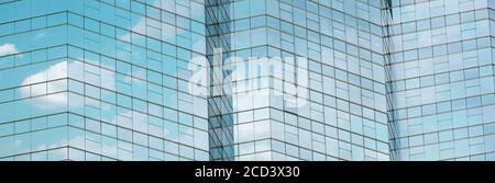 Cloud reflected in windows of modern office building. Stock Photo