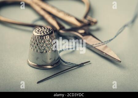 vintage silver thimble on blue Stock Photo