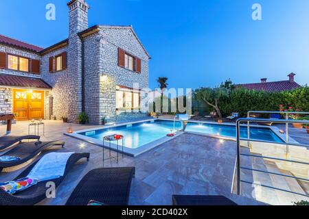 holiday home with swiiming pool at night Stock Photo