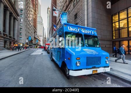 New York, United States - September 2019: Street food bus with greek cuisine on Wall Street financial, New York City in America. Stock Photo