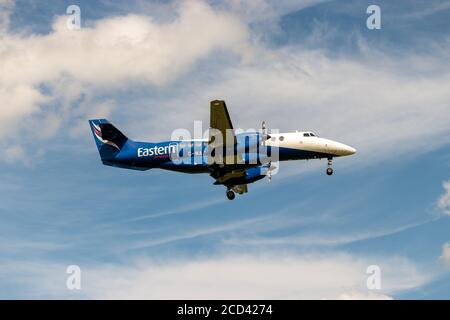 View of Jetstream 41 aircraft, G-MAJA, operated by Eastern Airways, landing at Leeds Bradford Airport Stock Photo