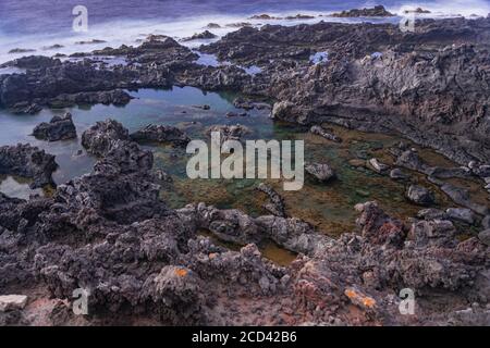 Los Silos volcanic natural saltwater puddles, long exposure, Tenerife, Canary islands, Spain Stock Photo