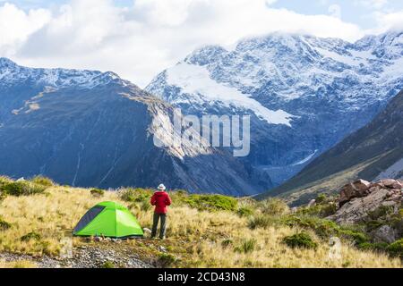Hiker in beautiful mountains near Mount Cook, New Zealand, South island Stock Photo