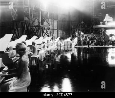 On set candid filming The Words Are In My Heart production number for GOLD DIGGERS OF 1935 director BUSBY BERKELEY art direction Anton Grot costumes Orry-Kelly First National Pictures / Warner Bros. Stock Photo