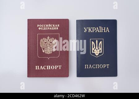 Ukrainian and Russian international passports. White background. Close up Stock Photo